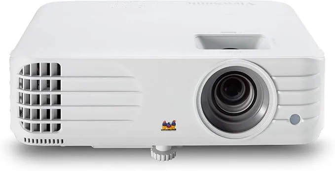This image displays a white ViewSonic PG706HD projector. The lens is prominently featured in the center-right of the front view, and the ViewSonic bird logo is visible on the front as well. Ventilation grilles are located on the left side of the projector.