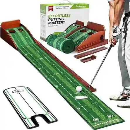 The image shows a Golfguru Putting Green. It features a green putting surface with a slight incline leading to two holes. The "Golfguru" logo is visible on the green. There's also a box labeled "EFFORTLESS PUTTING MASTERY" in the background. Sources and related content